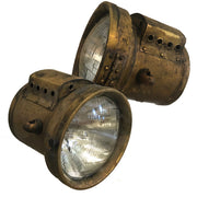 brass headlights with a patina finish